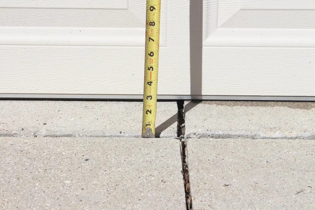 Before concrete repair in Berrien County, MI showing settled residential concrete before repair