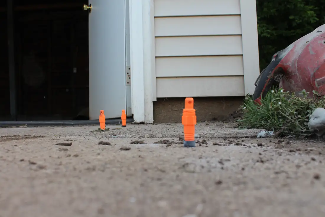 Before concrete step leveling in Berrien County, MI showing settled steps and entry concrete before repair