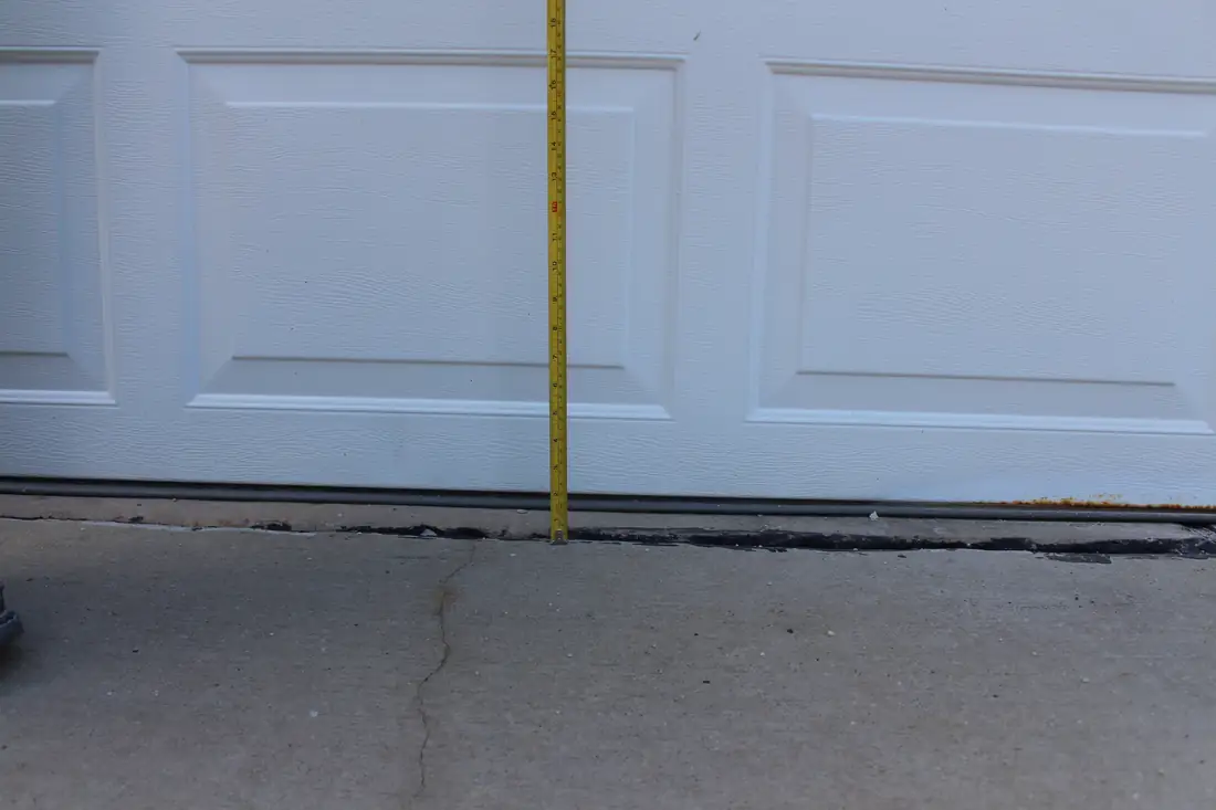 Before garage floor leveling in Berrien County, MI showing an uneven garage floor slab before repair
