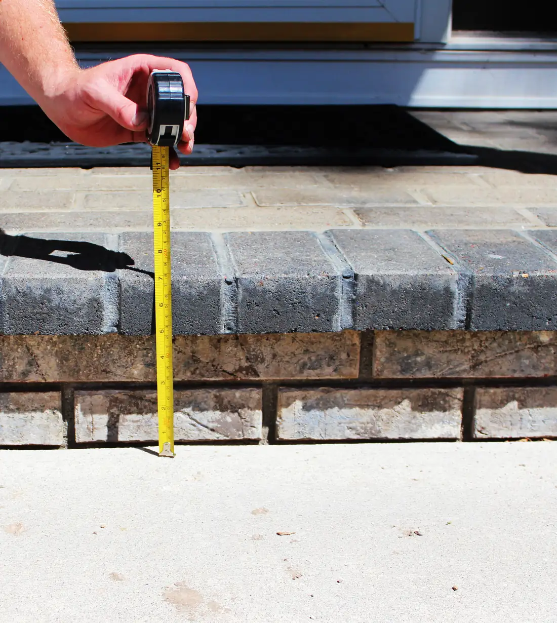 Before garage floor leveling in Berrien County, MI showing an uneven garage floor slab before repair
