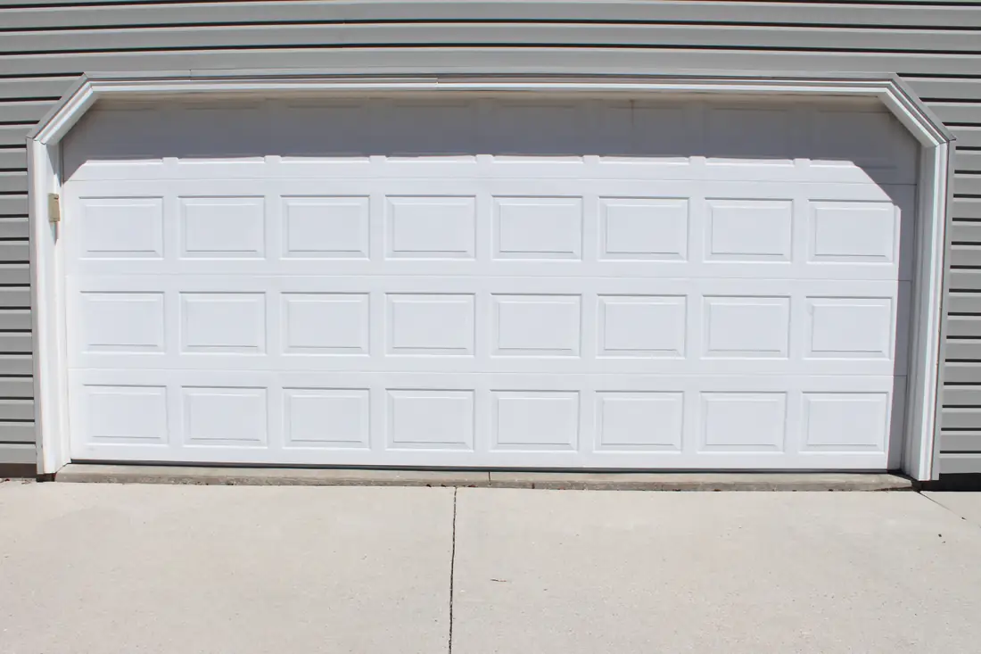 Before garage floor leveling near a settled garage door slab in Berrien County, MI