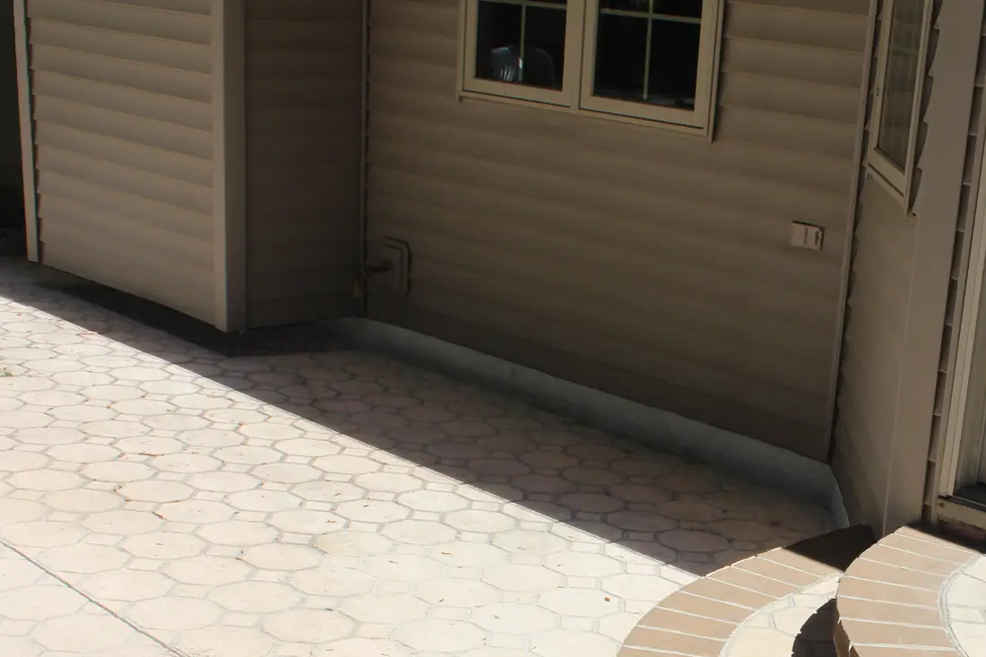 Before patio and side walkway concrete leveling in Berrien County, MI